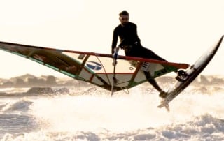 Foivos Tsoupras makes a Shaka windsurfing